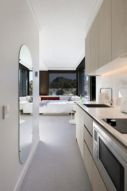 Bed kitchen with microwave and oven studio apartment at Iglu Waterloo in Sydney Student Accommodation
