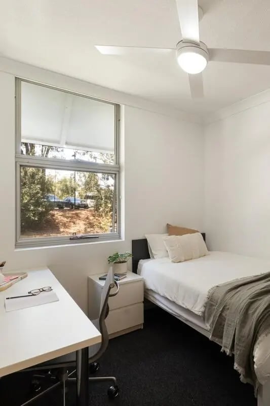 Bed desk and ceiling fan bedroom at Iglu Kelvin Grove in Brisbane Student Accommodation