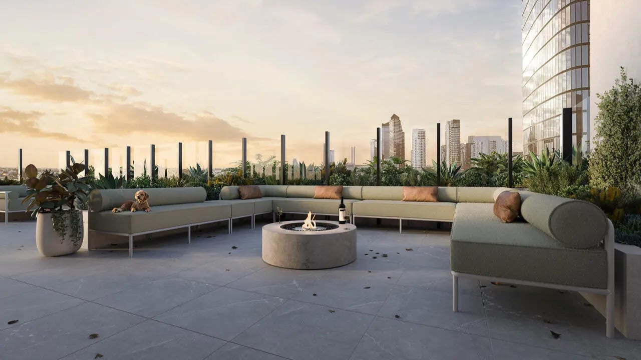 Outdoor lounge with fire pit and city view patio at The Archive - Residential Living in Melbourne Student Accommodation