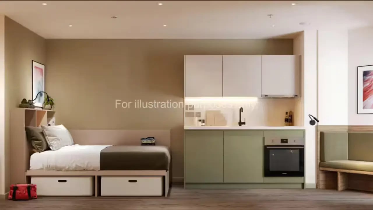 Bed with kitchen and seating area at The Malt Works in Edinburgh Student Accommodation
