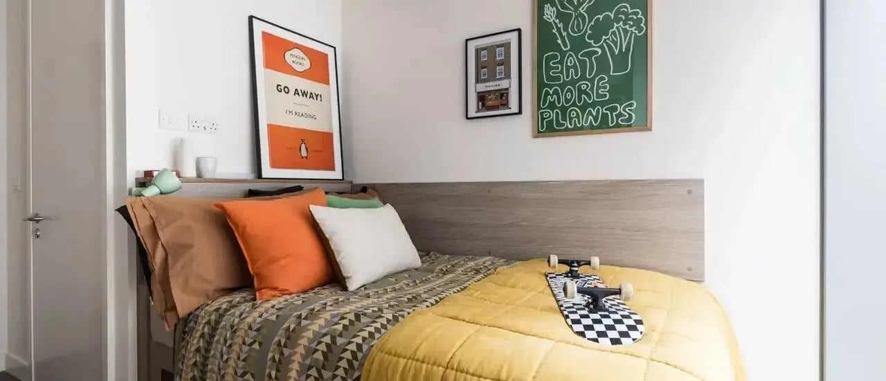 Bed pillows skateboard artwork decor bedroom at Chapter London Bridge in London Student Accommodation