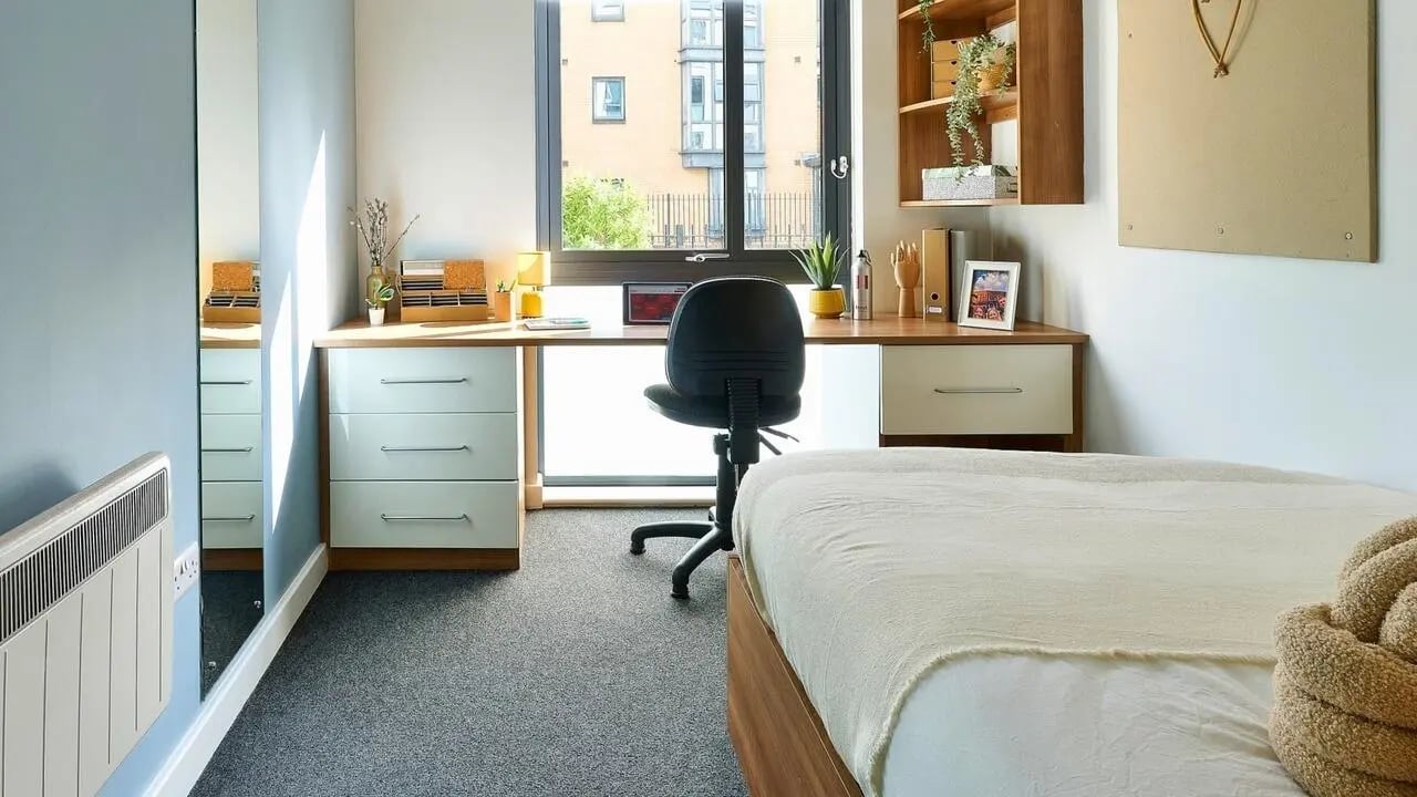 Desk chair bed and dresser student bedroom at Cavendish Place in Manchester Student Accommodation