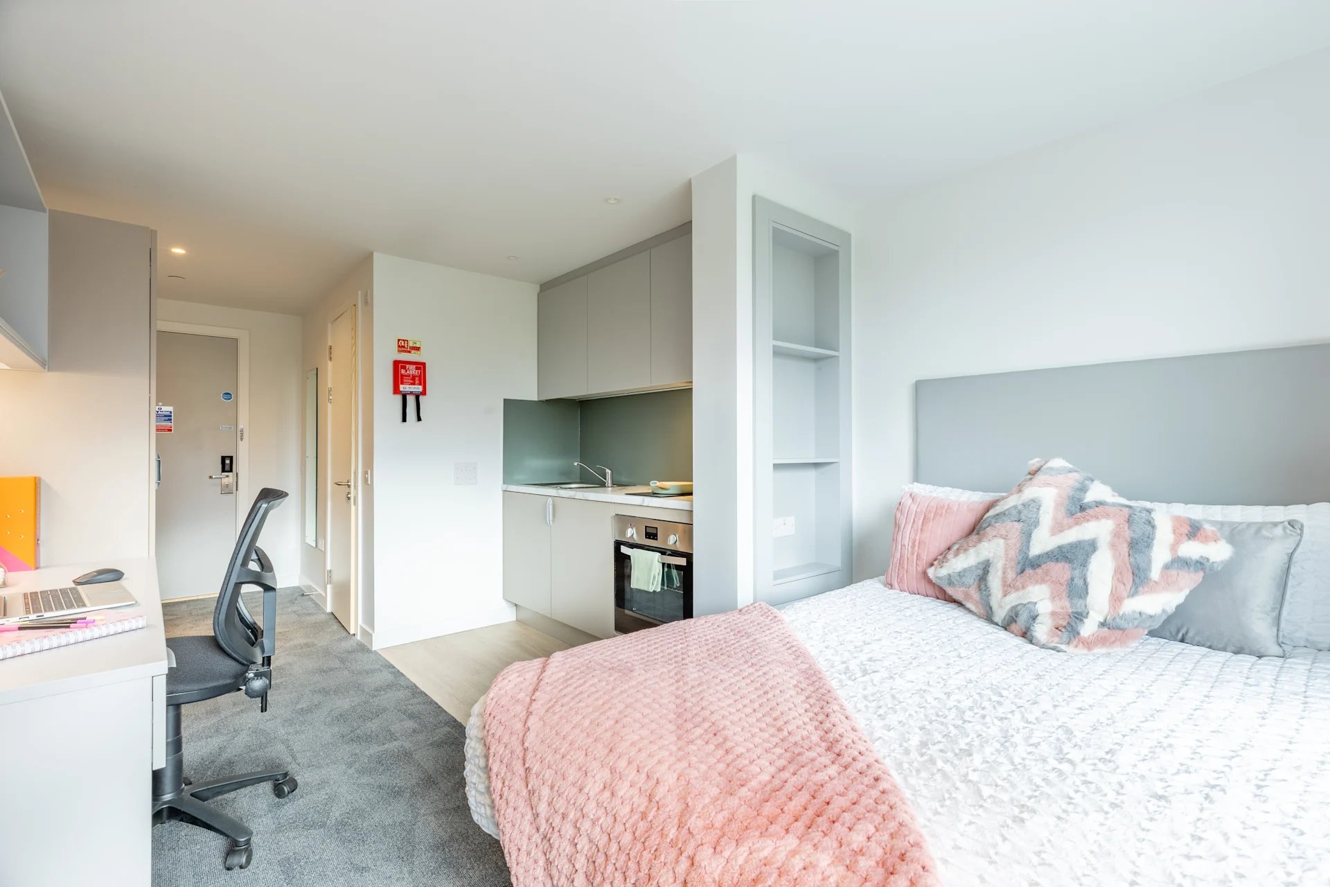 Bed desk chair kitchen and doors bedroom at Glasgow West-End in Glasgow Student Accommodation