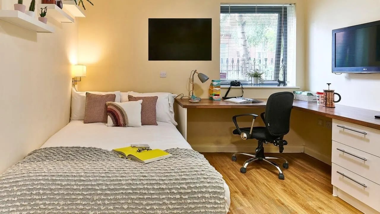 Bed desk chair and drawers student bedroom at The Hub in London Student Accommodation