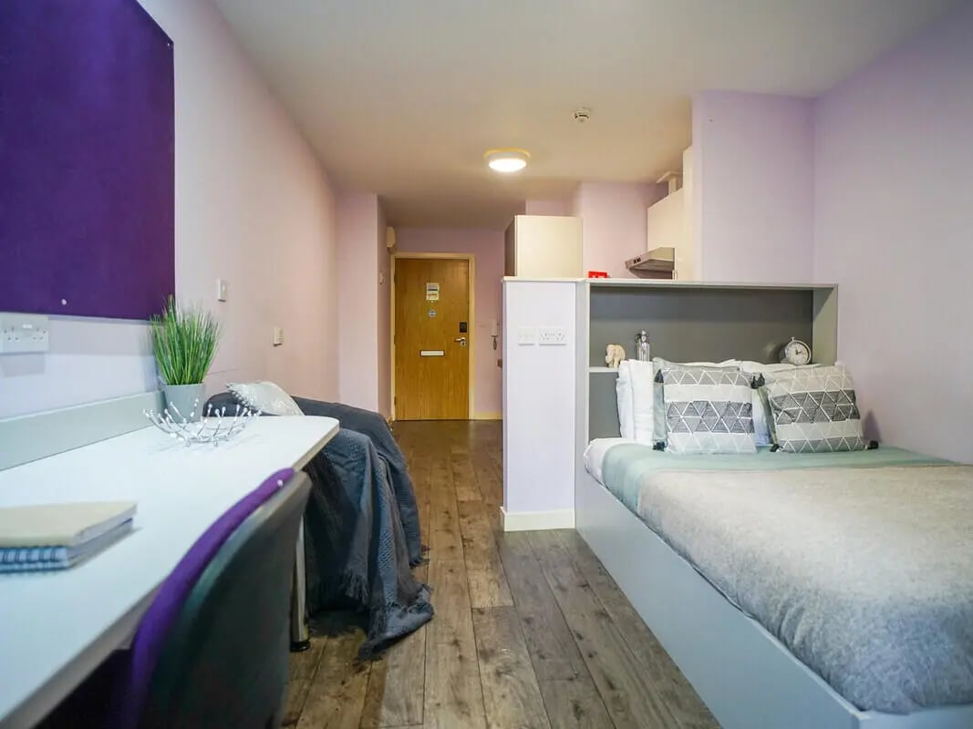 Bed desk chair purple board study area bedroom at AXO Oxford Circus in London Student Accommodation