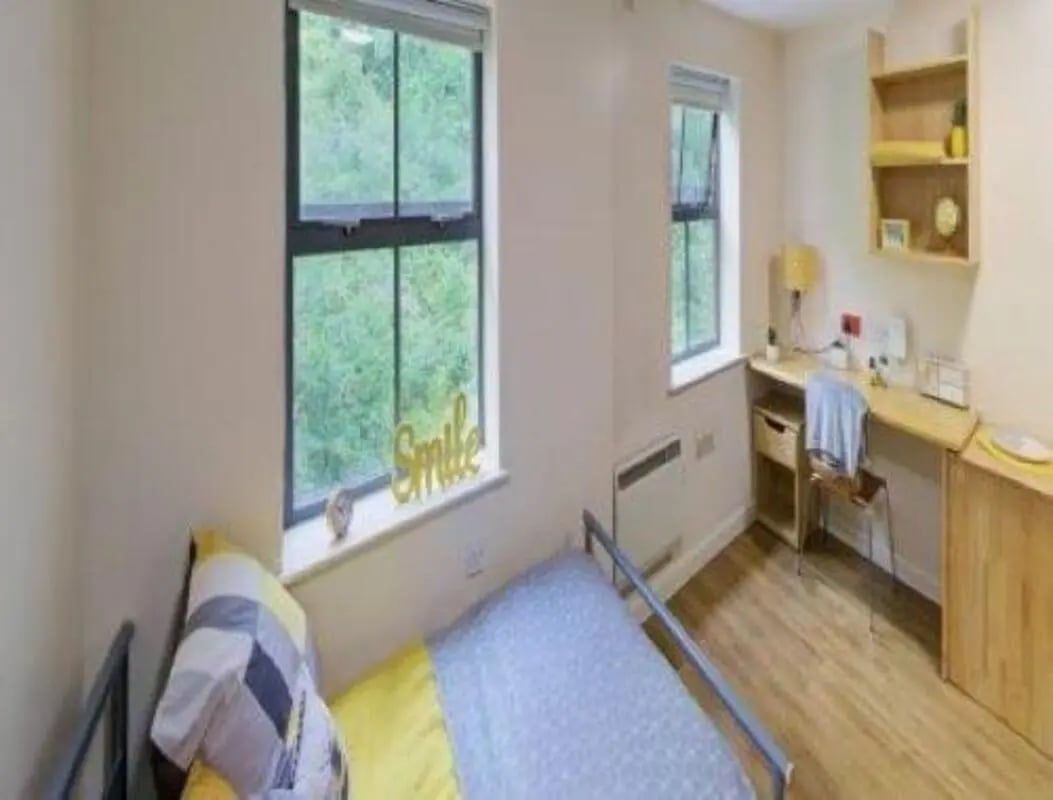 Bed desk chair and shelves student bedroom at dwell Hotwells House in Bristol Student Accommodation