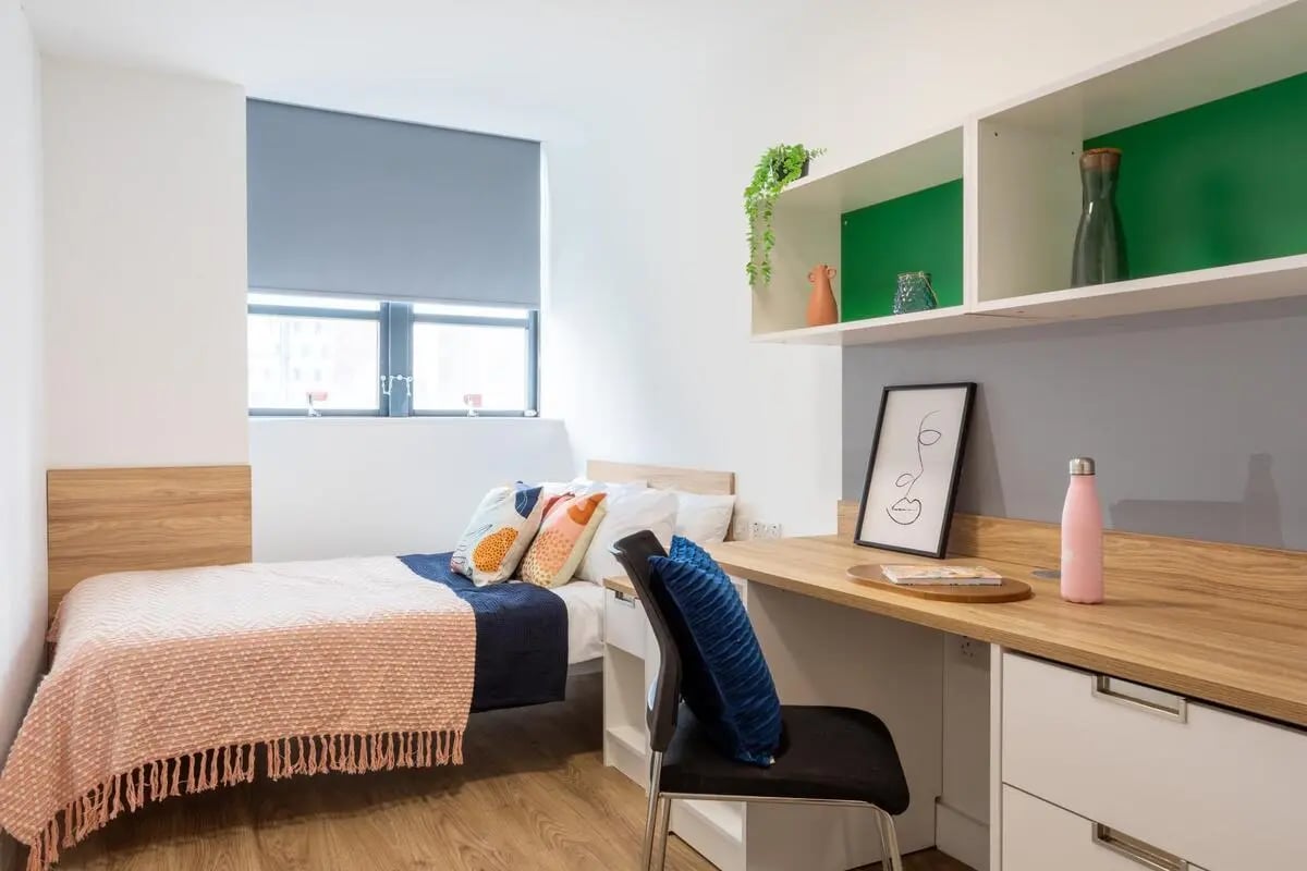 Bed desk chair and shelves bedroom study area at dwell Hotwells House in Bristol Student Accommodation