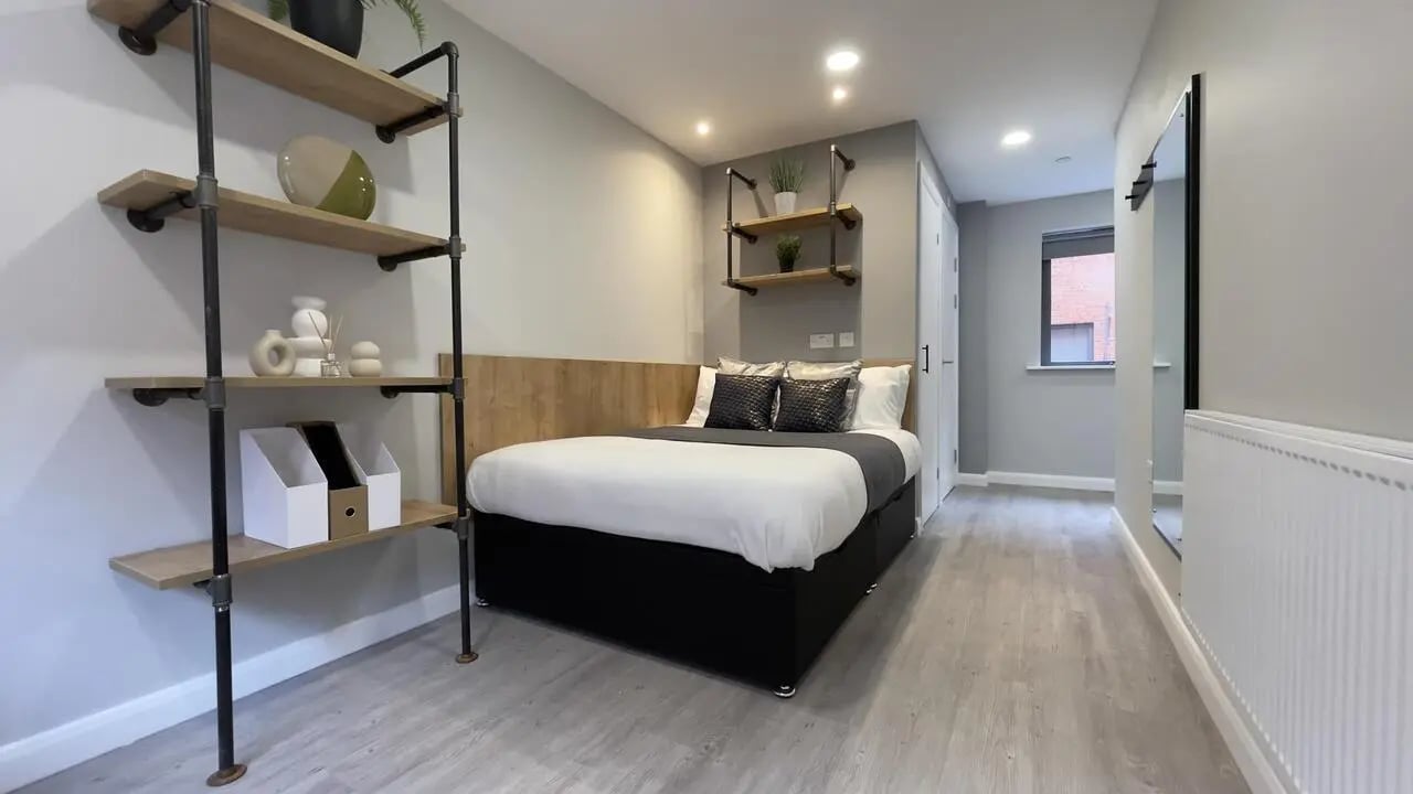 Bed shelves and storage baskets bedroom at Electric Press in Sheffield Student Accommodation