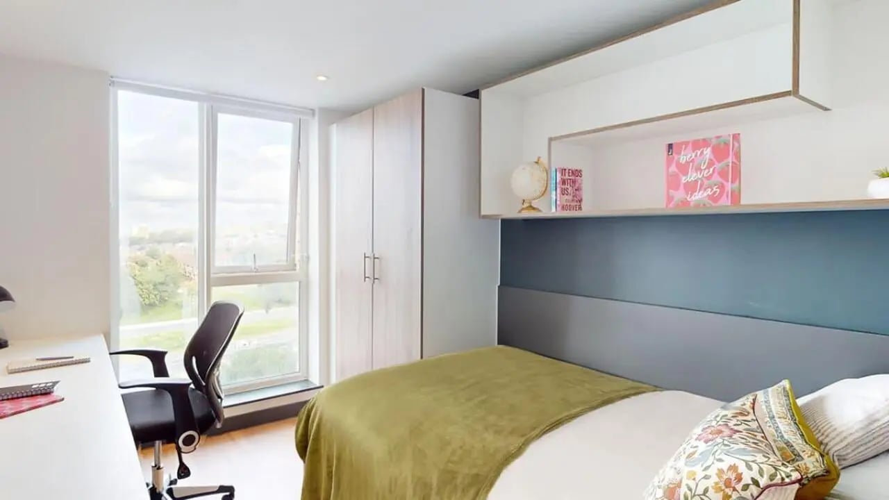 Bed desk chair wardrobe with large window Bedroom at Innovo House in Liverpool Student Accommodation