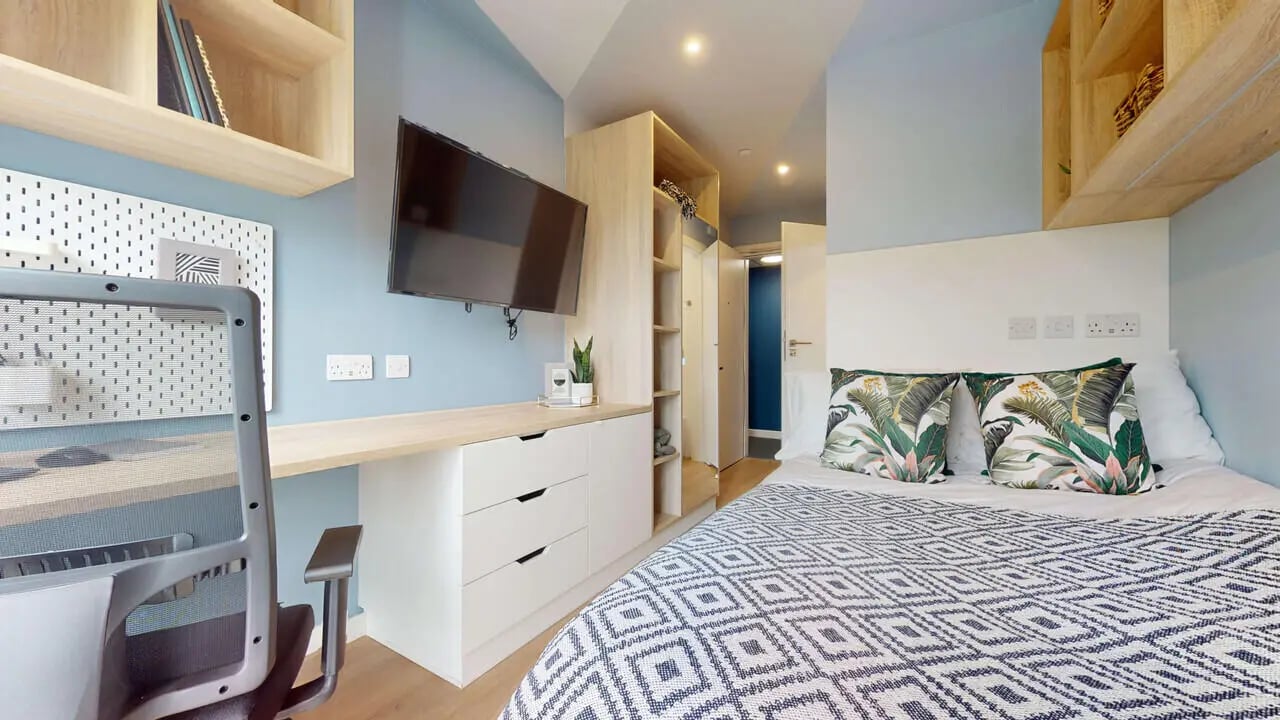 Bed desk television wardrobe bedroom with pillows bedroom at Mayfield Residences in Edinburgh Student Accommodation