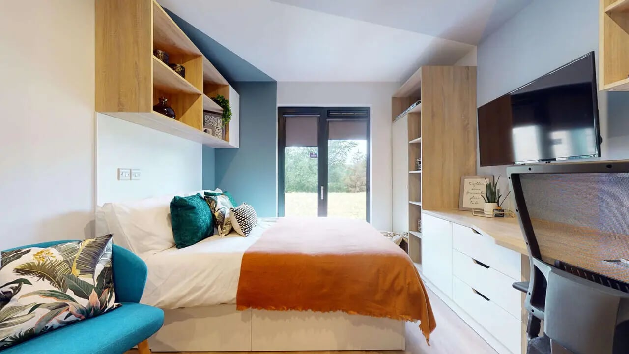 Bed desk shelves and TV bedroom at Mayfield Residences in Edinburgh Student Accommodation