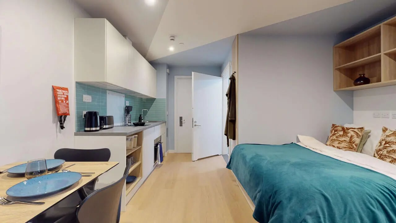 Kitchen bed table and chairs student studio at Mayfield Residences in Edinburgh Student Accommodation