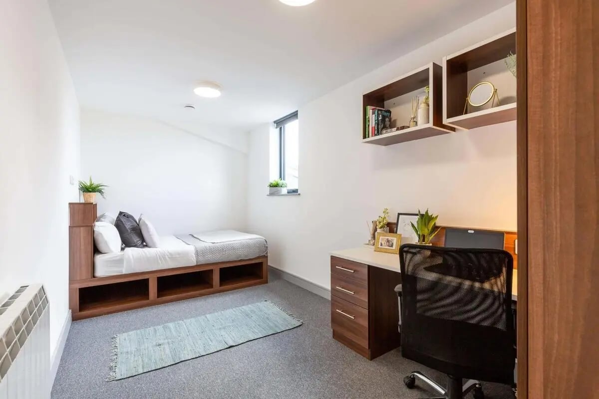Bed desk chair rug shelves bedroom at The Foundry in Leeds Student Accommodation