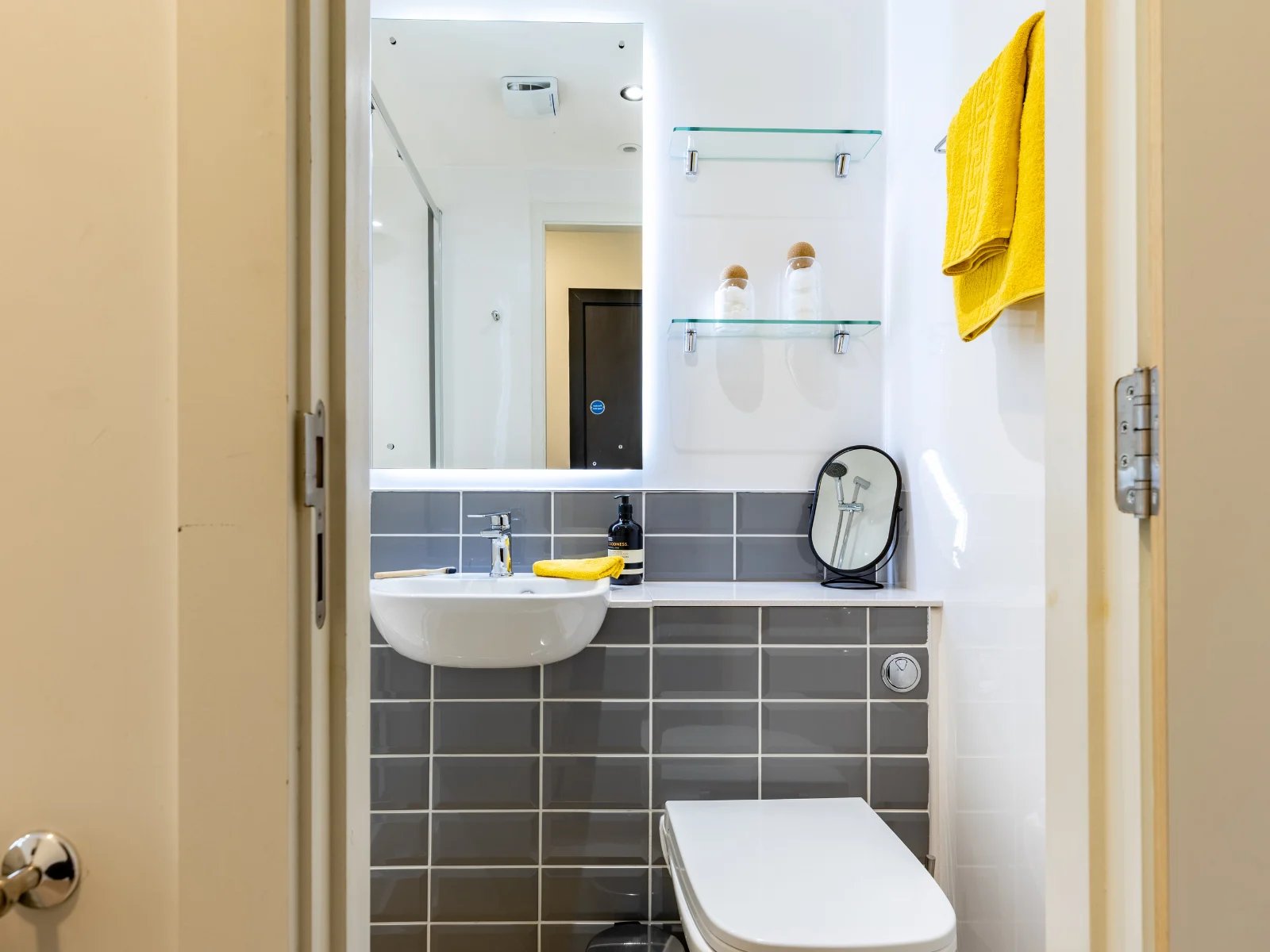 Sink toilet mirror shelves towel bathroom at Ardee Point in Dublin Student Accommodation