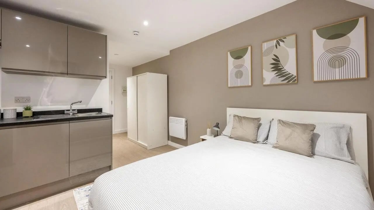 Bed with kitchen and wardrobe student studio at Sizer Court in Preston Student Accommodation