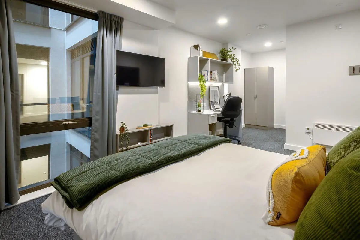 Bed desk wardrobe and window bedroom at True Leicester in Leicester Student Accommodation
