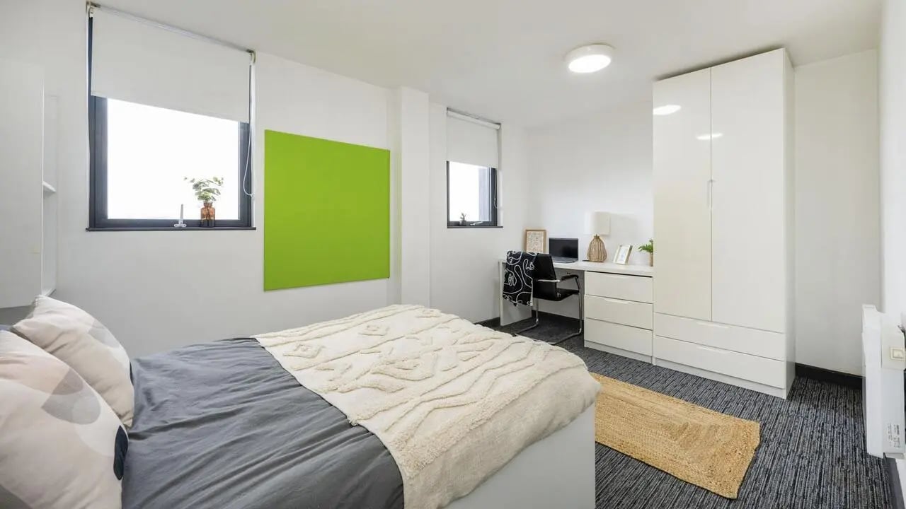 Bed desk and wardrobe student accommodation bedroom at Glassworks - Liverpool in Liverpool Student Accommodation