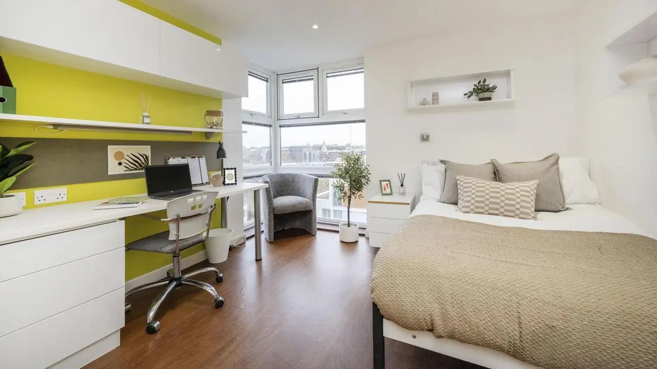 Desk chair laptop bed armchair plant bedroom at Griffon Studios in London Student Accommodation