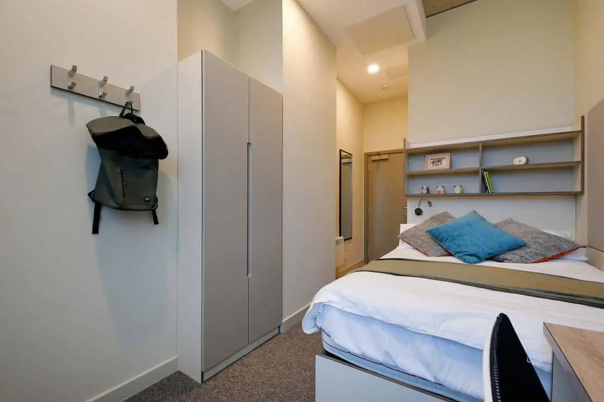Closet bed with shelves and pillows bedroom at LIV Student Sheffield in Sheffield Student Accommodation