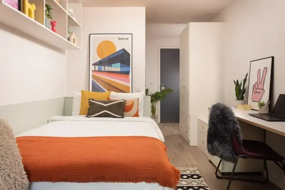 Bed desk shelving and wardrobe bedroom study area at Hawthorne House in London Student Accommodation