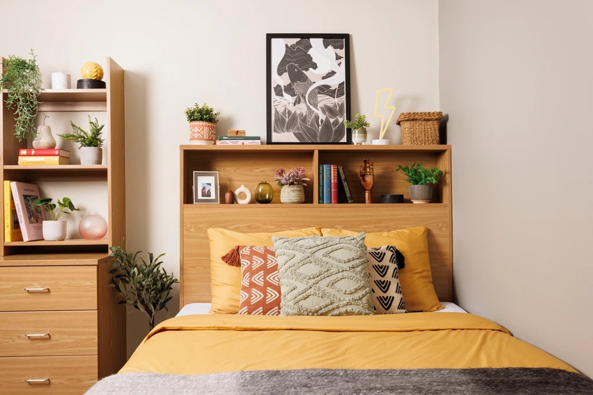 Bed with yellow bedding and decorative pillows bedroom at Manor Bank in Newcastle Upon Tyne Student Accommodation