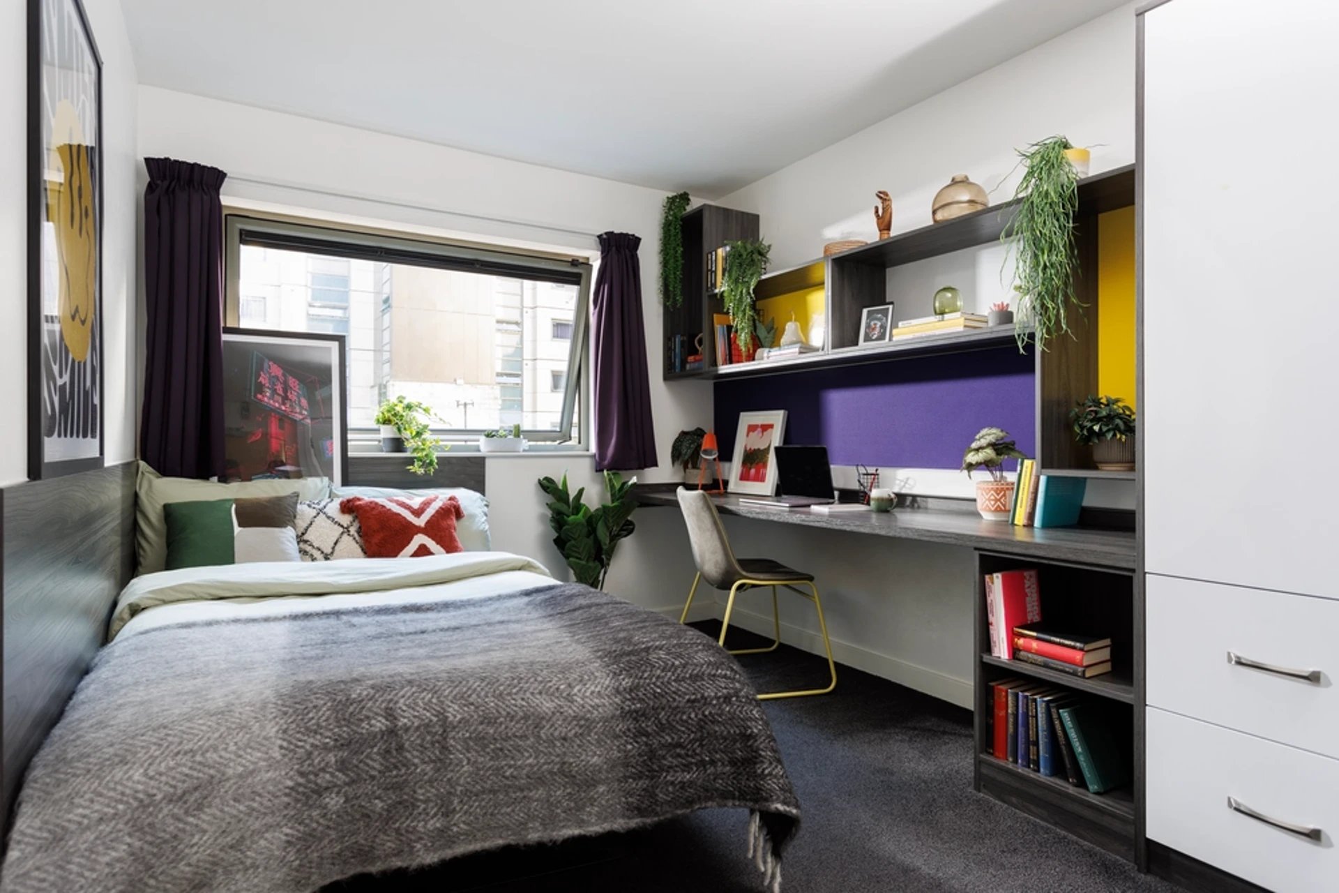 Bed desk plants and shelving student bedroom at Sir Charles Groves Hall in Manchester Student Accommodation