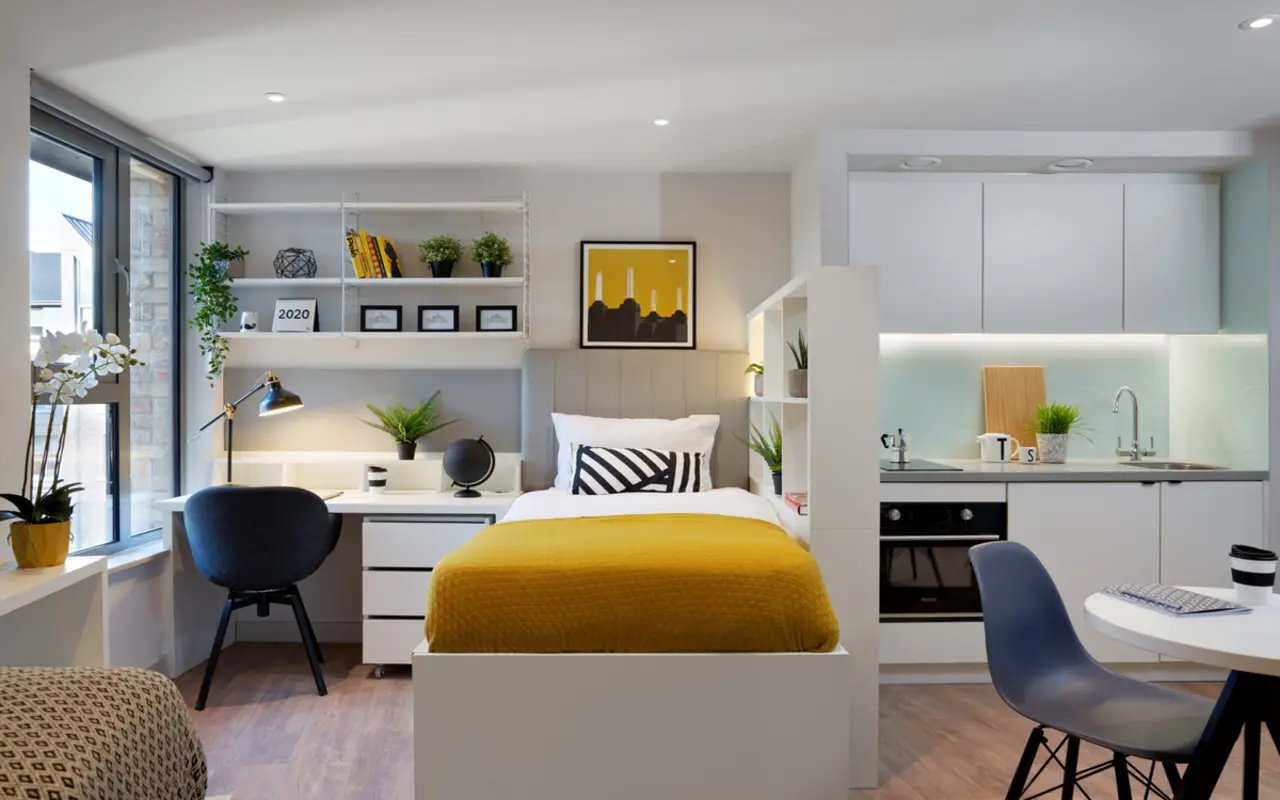 Bed desk kitchen with oven sink living space bedroom at Student Castle Durham in Durham Student Accommodation