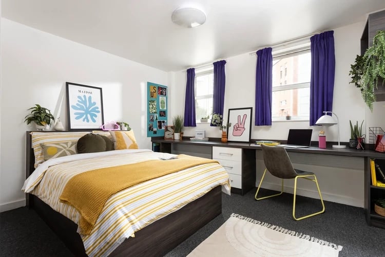 Bed desk chair artwork laptop bedroom at Mill Point in Manchester Student Accommodation