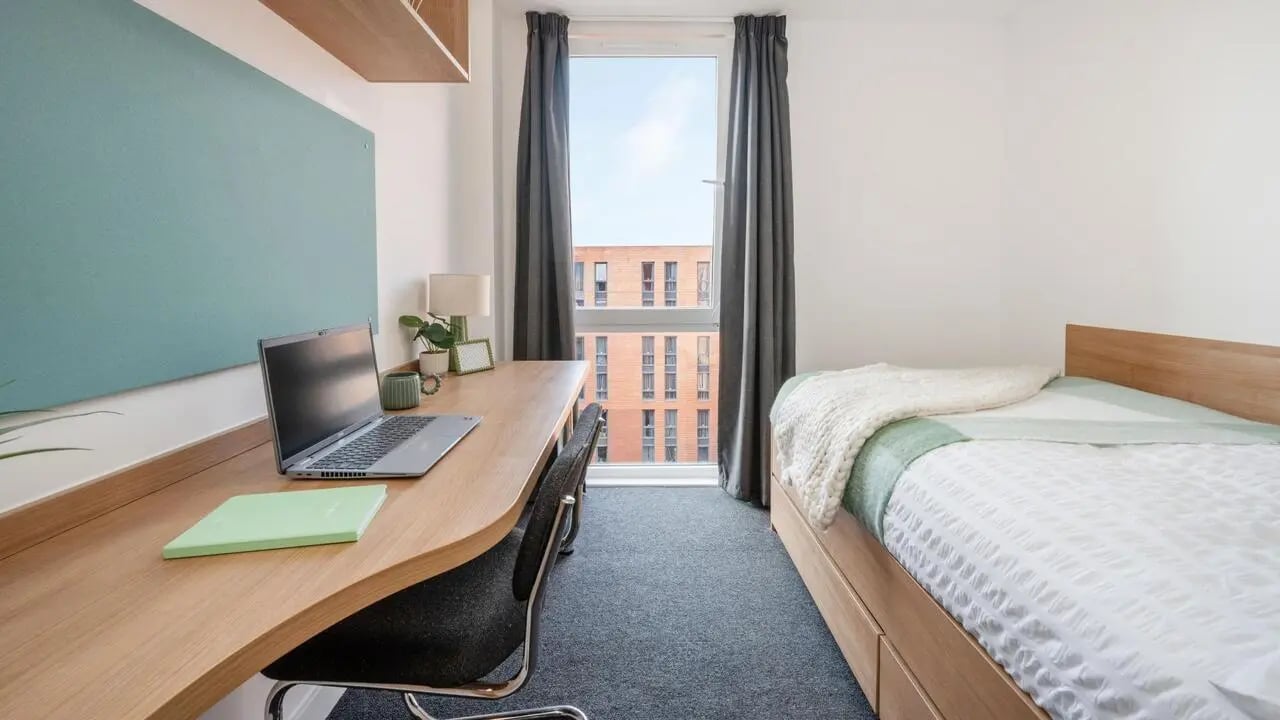 Desk bed laptop and window Bedroom at The Elements in Sheffield Student Accommodation
