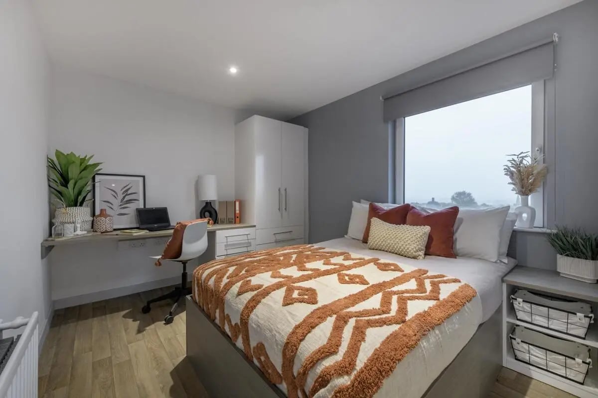 Bed desk wardrobe and window bedroom at The Bridge in Newcastle Upon Tyne Student Accommodation