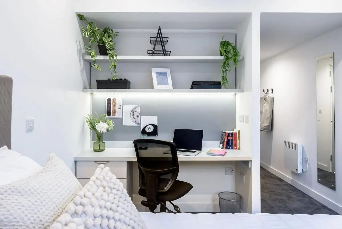 Desk with laptop plants and chair Study Area at True Swansea in Swansea Student Accommodation