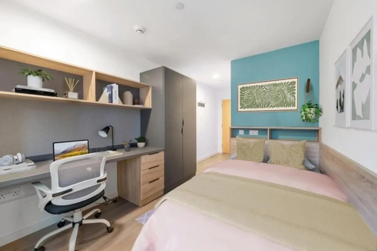 Desk bed wardrobe and shelves student bedroom at Wembley Barnard Point in London Student Accommodation