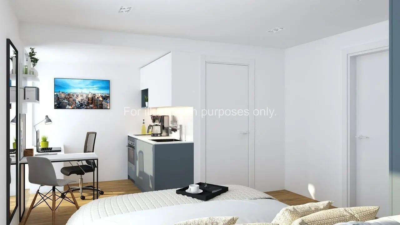 Desk kitchen area and bed studio apartment at Axiom in Stoke-On-Trent Student Accommodation