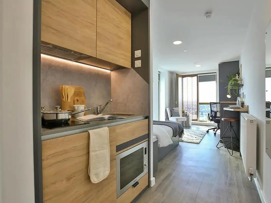 Studio kitchen with bed desk and chair studio at The Valentine London in London Student Accommodation