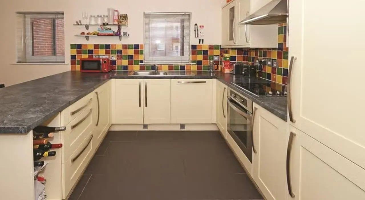 Cream kitchen cabinets sink and oven kitchen at Hassells Bridge House in Newcastle Under Lyme Student Accommodation