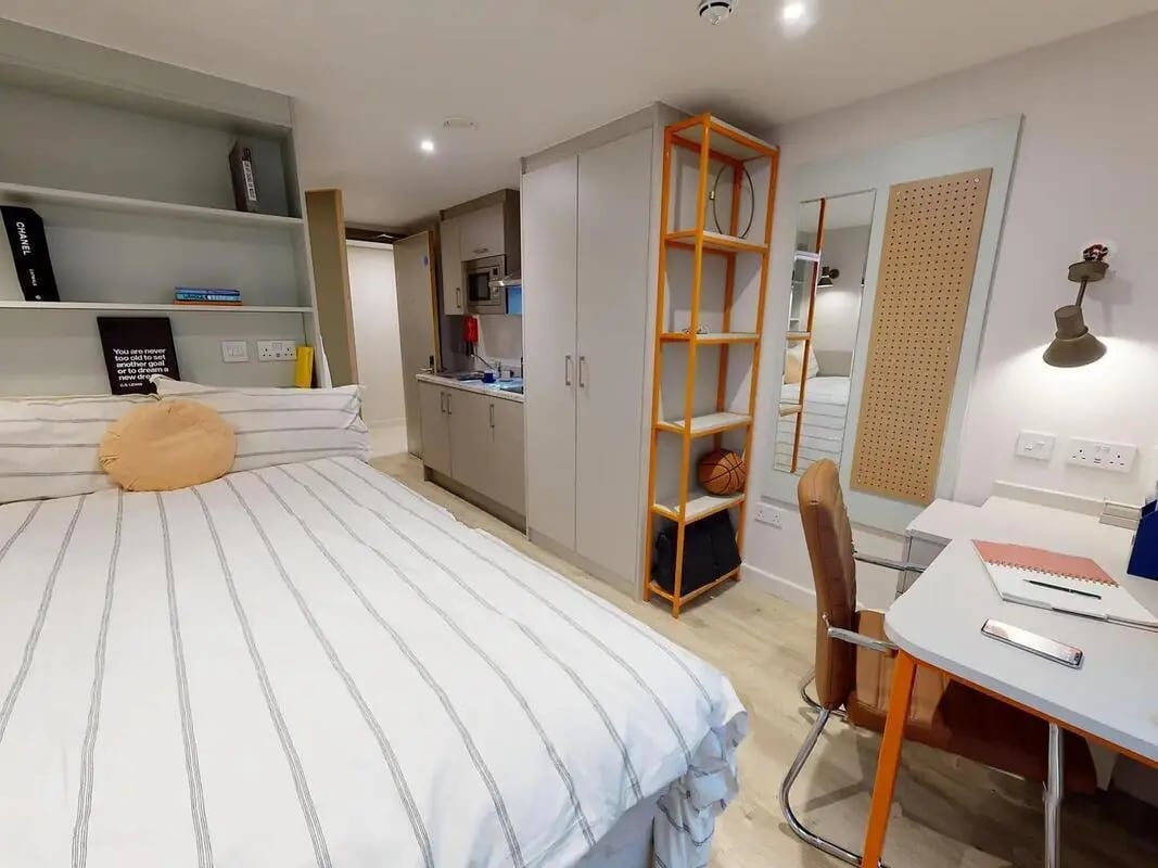 Bed desk kitchen area shelving unit studio at COSMOS in Sheffield Student Accommodation