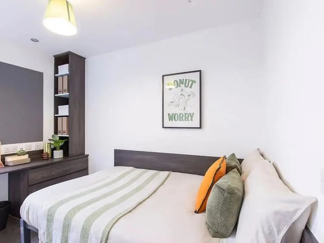 Bed desk and shelves with items Bedroom at The Foundry Newcastle in Newcastle Upon Tyne Student Accommodation