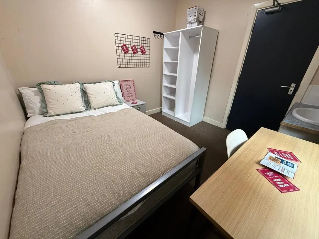 Bed wardrobe table sink bedroom at 8 Bedroom House at 73, Dallas Street in Preston Student Accommodation