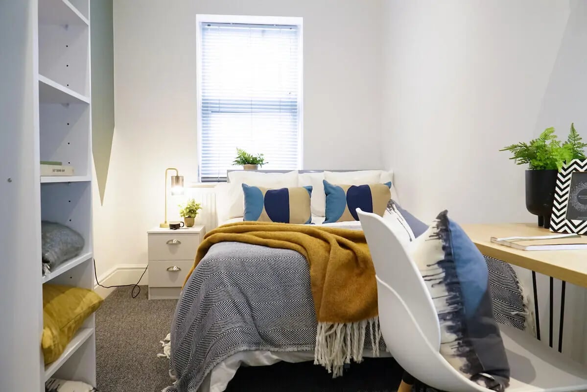 Bed nightstand shelf and desk bedroom at 4 Bedroom House at 24, Studios at, West Parade in Lincoln Student Accommodation