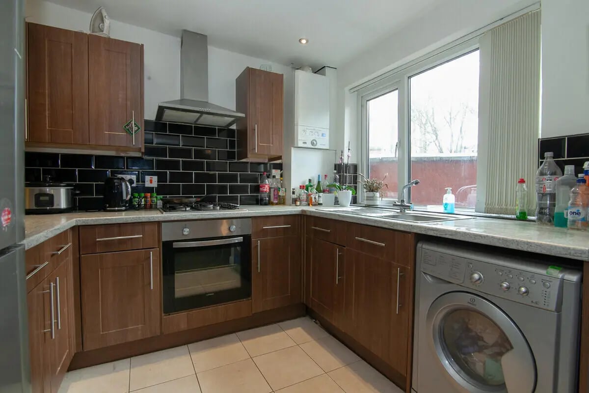 Wood cabinets oven washer window appliances kitchen at 5 Bedroom House at 11, Mildred Street in Salford Student Accommodation