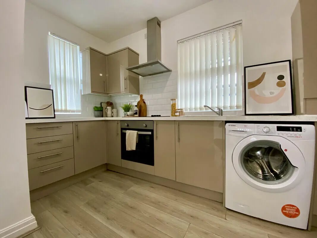 Modern kitchen with integrated appliances and washing machine kitchen at 1 Bedroom House at Flat 3, 261, Edge Lane in Liverpool Student Accommodation