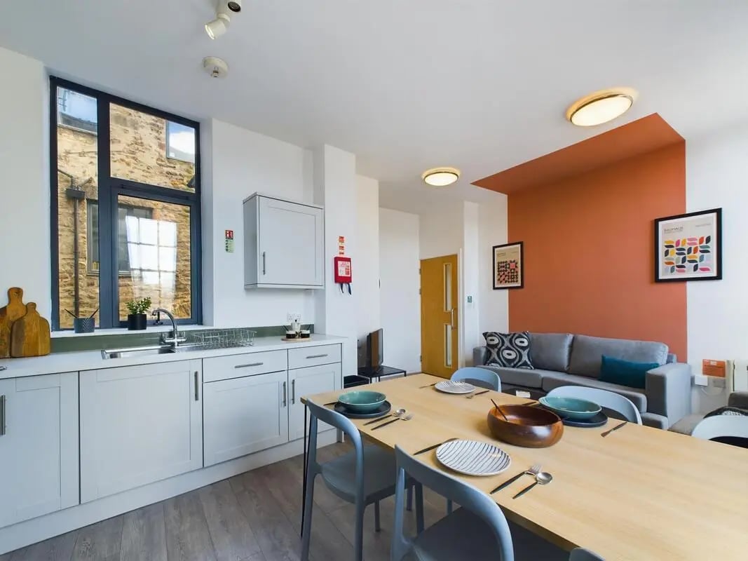 Kitchen dining and living area with sofa at 5 Bedroom House at Flat 4, 18, China Street in Lancaster Student Accommodation