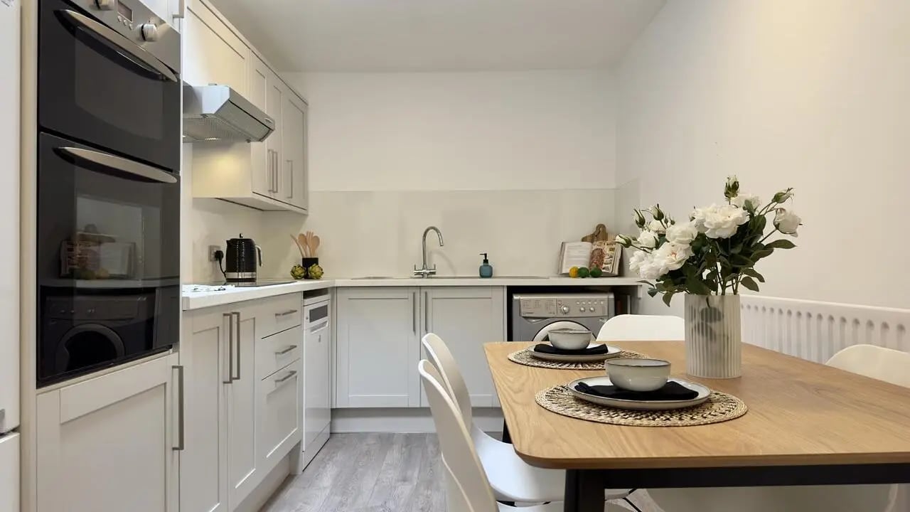 Double oven washing machine dining table kitchen at 6 Bedroom House at 19C, Bower Road in Sheffield Student Accommodation