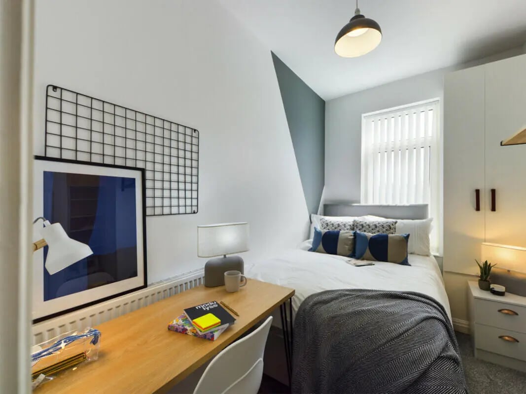 Desk bed closet bedside table Bedroom at 6 Bedroom House at 36, Brae Street in Liverpool Student Accommodation