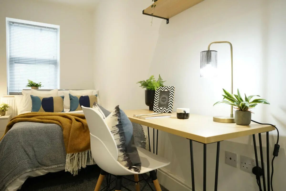 Bed desk lamp plants picture frame bedroom at 4 Bedroom House at 44, Mount Street in Lincoln Student Accommodation