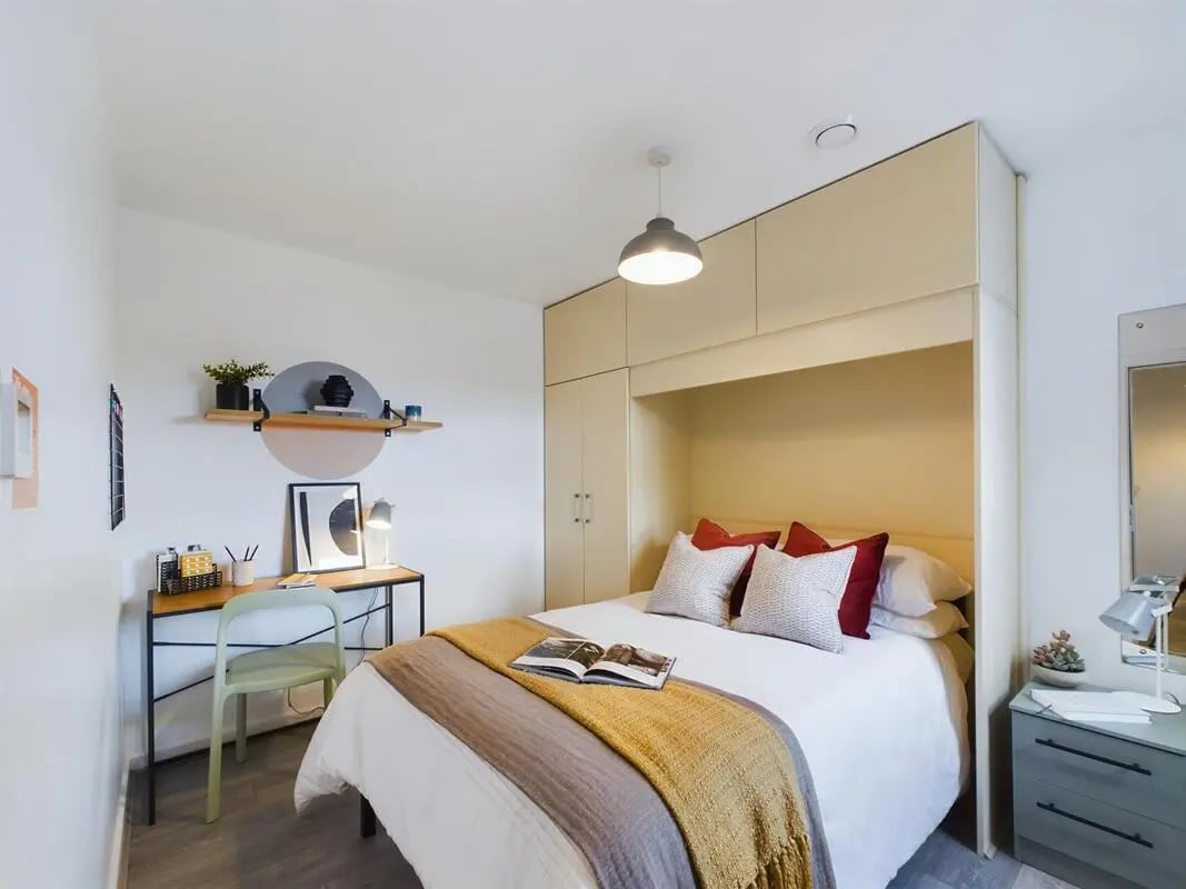 Bed with desk and shelves bedroom at 6 Bedroom House at 174, ACOMB STREET in Manchester Student Accommodation