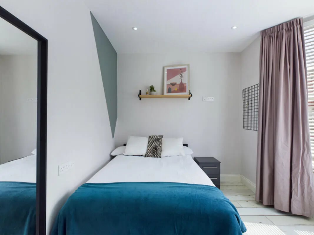 Bed bedside table artwork and mirror bedroom at 8 Bedroom House at 211, Molyneux Road in Liverpool Student Accommodation