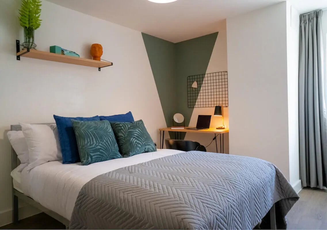Bed desk lamp laptop shelf fern bedroom at 5 Bedroom House at 38, Cavendish Street in Lancaster Student Accommodation