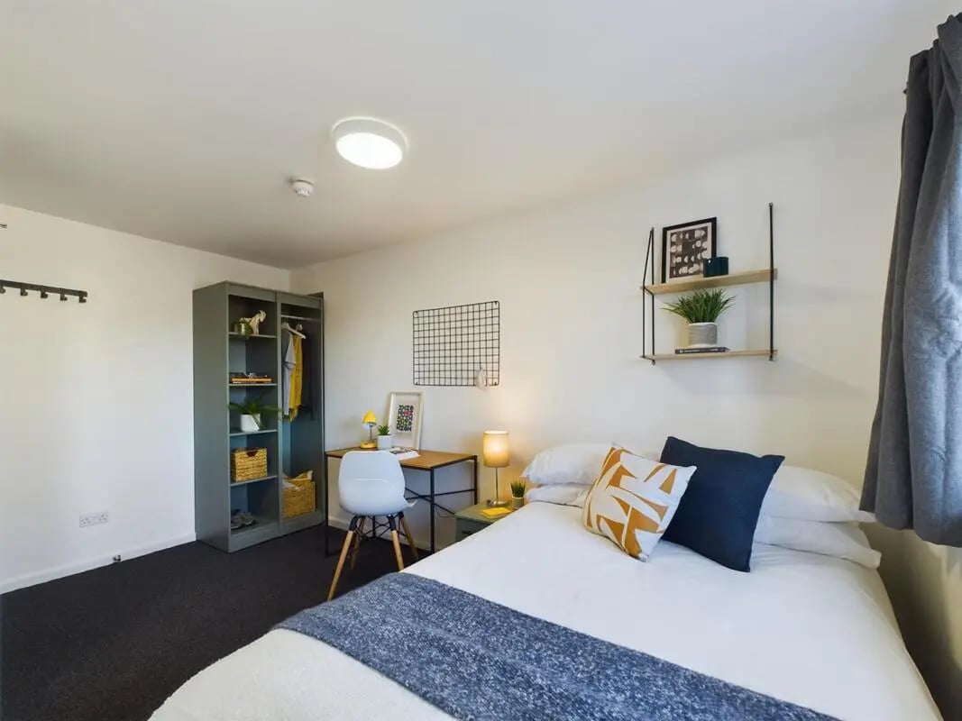 Wardrobe desk chair bed with pillows bedroom at 4 Bedroom House at 8, Brookside in Derby Student Accommodation