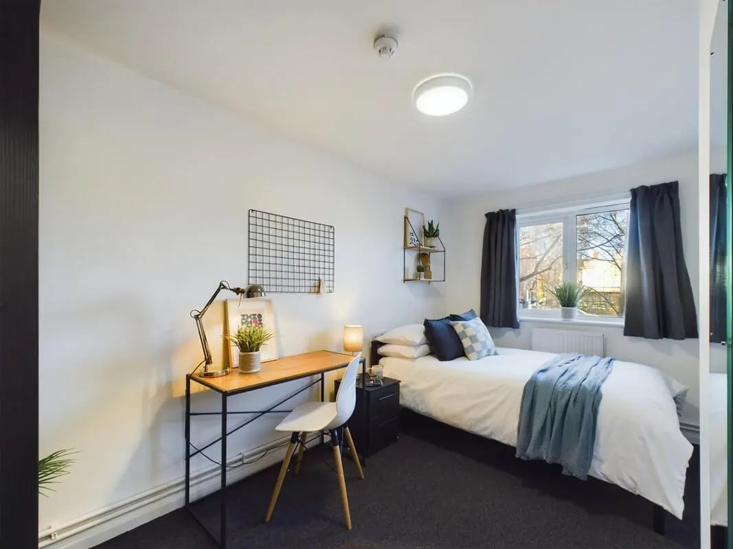 Bed desk chair and window view bedroom at 4 Bedroom House at 12, Brookside in Derby Student Accommodation
